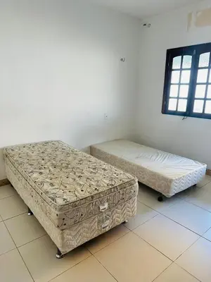 Uma cama ou camas num quarto em Pousada sua casa