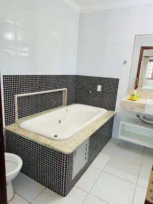 Uma casa de banho em Pousada sua casa