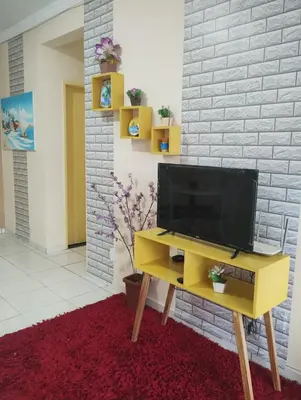 Uma televisão e/ou sistema de entretenimento em Apartamento para temporada na Praia do Futuro II - Fortaleza CE