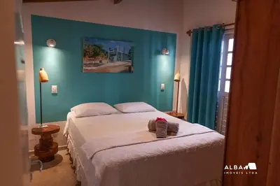 Uma cama ou camas num quarto em Casa Minerva Pontal