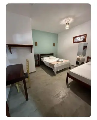 Uma cama ou camas num quarto em Vila Lua Aparts - Apartamento 2
