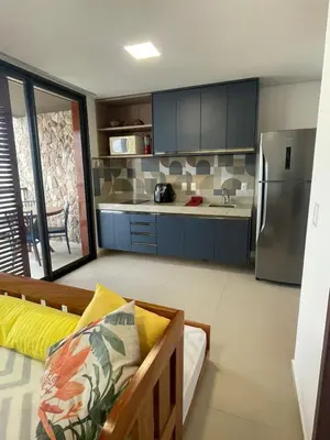 A cozinha ou kitchenette de Loft Charmoso com Rooftop no Vila das Dunas