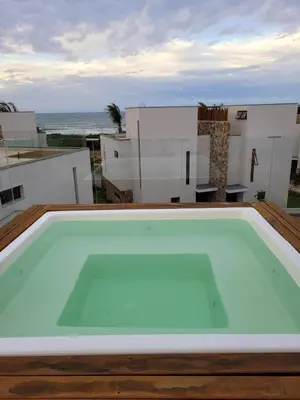 A piscina em ou perto de Loft Charmoso com Rooftop no Vila das Dunas
