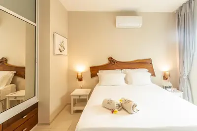 Uma cama ou camas num quarto em Kite Dream Cumbuco Apartments 60 & 120qm
