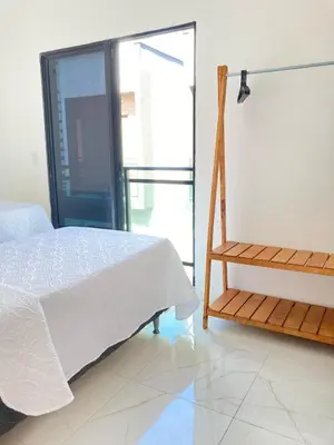 Uma cama ou camas num quarto em Casa Arizzu Cumbuco