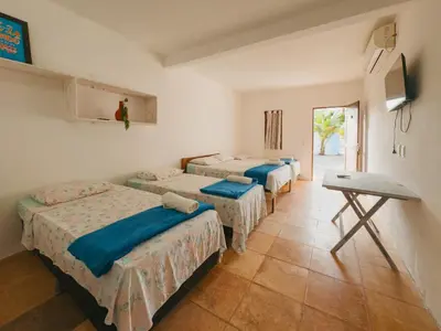 Uma cama ou camas num quarto em Pousada Recanto dos Ventos