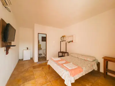 Uma cama ou camas num quarto em Pousada Recanto dos Ventos
