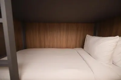 Uma cama ou camas num quarto em W Airport Rooms Fortaleza