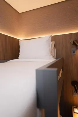 Uma cama ou camas num quarto em W Airport Rooms Fortaleza