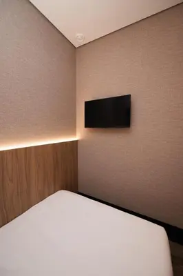 Uma televisão e/ou sistema de entretenimento em W Airport Rooms Fortaleza
