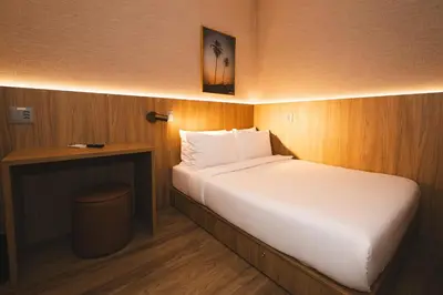 Uma cama ou camas num quarto em W Airport Rooms Fortaleza