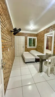 Uma cama ou camas num quarto em Chalés Santo Antônio em Flecheiras