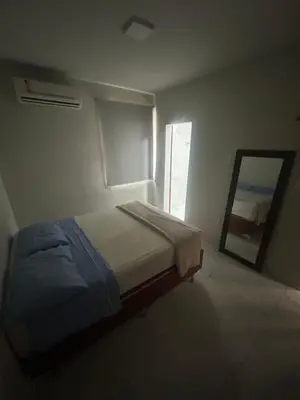 Uma cama ou camas num quarto em GT Hostel