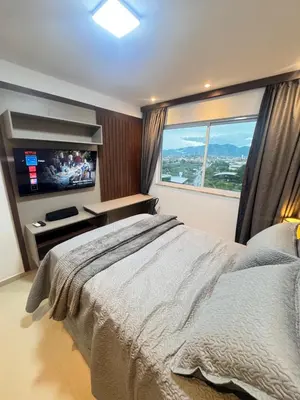 Uma cama ou camas num quarto em Melhor Ap em Sobral de frente ao Shopping