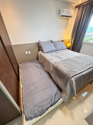 Uma cama ou camas num quarto em Melhor Ap em Sobral de frente ao Shopping
