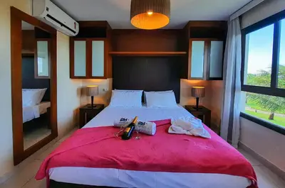 Uma cama ou camas num quarto em VG Sun Cumbuco Nascente Vista Mar 4 Pessoas