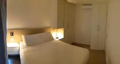 Uma cama ou camas num quarto em VG Fun Residence Praia do Futuro