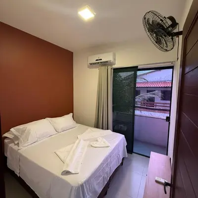 Uma cama ou camas num quarto em Triplex Flecheiras
