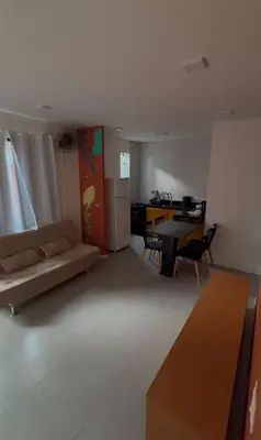 Uma área de estar em Triplex Flecheiras