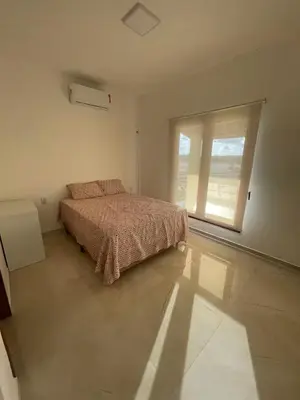 Uma cama ou camas num quarto em Clube Mirante do Iguape