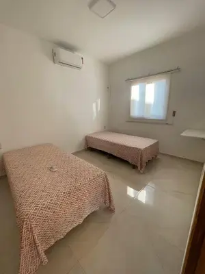 Uma cama ou camas num quarto em Clube Mirante do Iguape