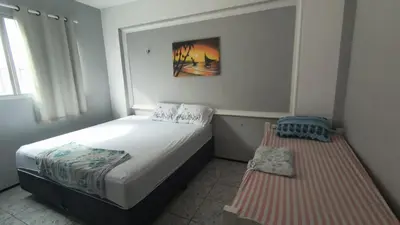 Uma cama ou camas num quarto em Brisa Mar