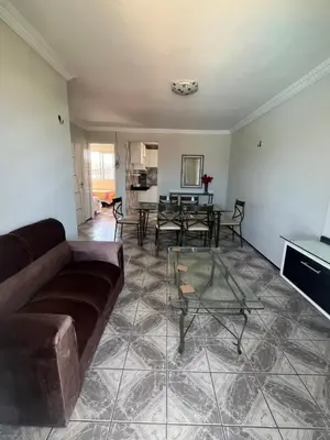 Uma área de estar em Condomínio Vista Mar