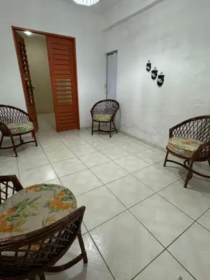 Uma área de estar em Casa flecheiras