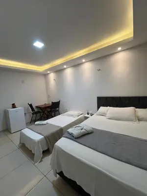Uma cama ou camas num quarto em Suítes Nativa