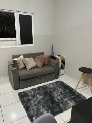 Uma área de estar em Apartamento