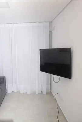 Uma televisão e/ou sistema de entretenimento em Apartamento Meireles Praia de Iracema e Beira mar