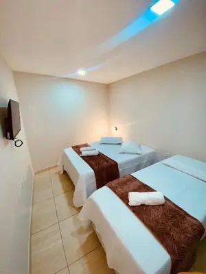 Uma cama ou camas num quarto em Pousada Iracema Charme