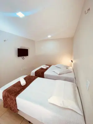 Uma cama ou camas num quarto em Pousada Iracema Charme