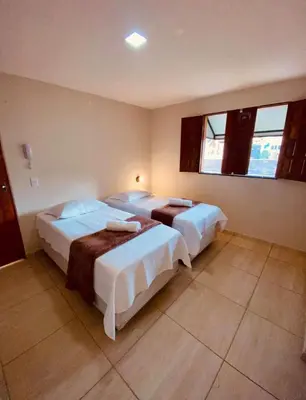 Uma cama ou camas num quarto em Pousada Iracema Charme