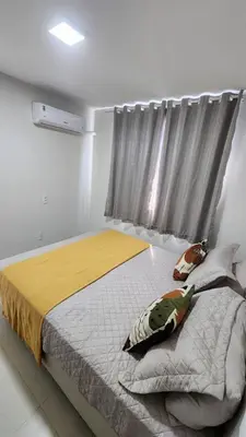 Uma cama ou camas num quarto em Mirante Clube - Praia do Futuro