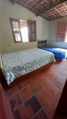 Uma cama ou camas num quarto em Casa de Praia em Parajuru