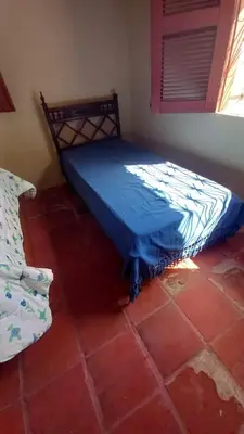 Uma cama ou camas num quarto em Casa de Praia em Parajuru