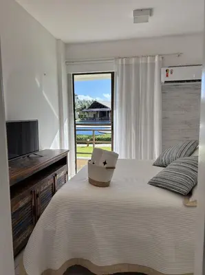 Uma cama ou camas num quarto em Apartamento Térreo no Beach Place