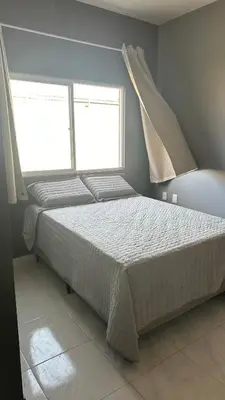 Uma cama ou camas num quarto em Pousada Avenida Beberibe