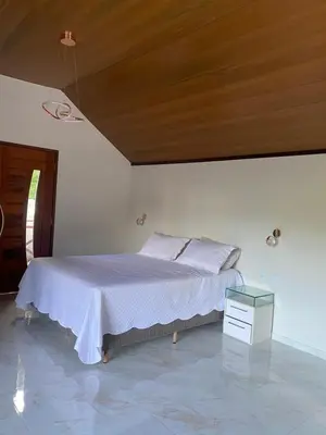 Uma cama ou camas num quarto em Chalé Bella Vista