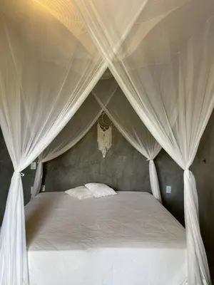 Uma cama ou camas num quarto em Vila Angatu