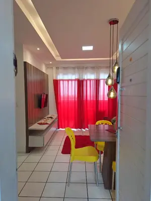 Uma área de estar em Apartamento para temporada Beira Mar