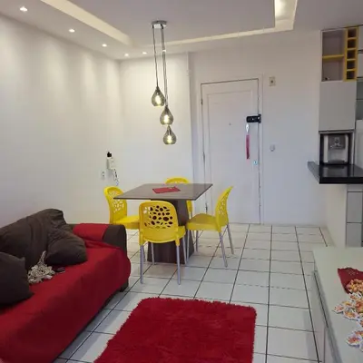 Uma área de estar em Apartamento para temporada Beira Mar