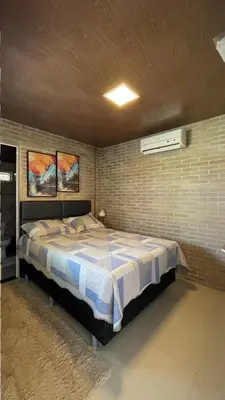 Uma cama ou camas num quarto em Praiana house