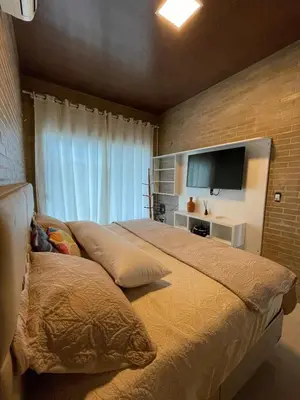 Uma cama ou camas num quarto em Praiana house