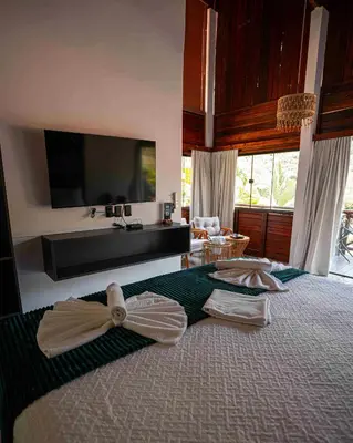 Uma cama ou camas num quarto em Azzuro Hotel
