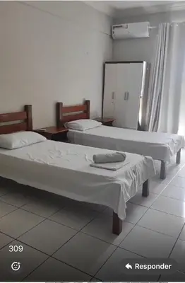 Uma cama ou camas num quarto em Hotel e Flat Sobral Mundi