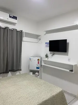 Uma televisão e/ou sistema de entretenimento em Apartamentos próximos ao aeroporto