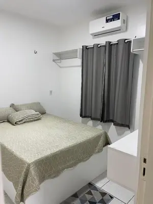 Uma cama ou camas num quarto em Apartamentos próximos ao aeroporto