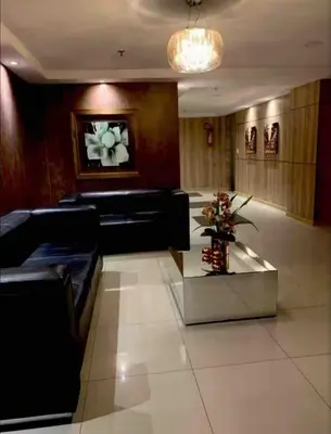 Uma área de estar em Apartamento a dois passos da beira mar